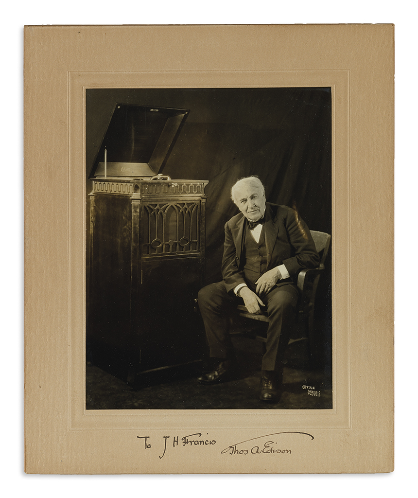 EDISON, THOMAS A. Photograph Signed and Inscribed, To J.H. Francis, full-length seated portrait by Lueder, showing him beside a phono